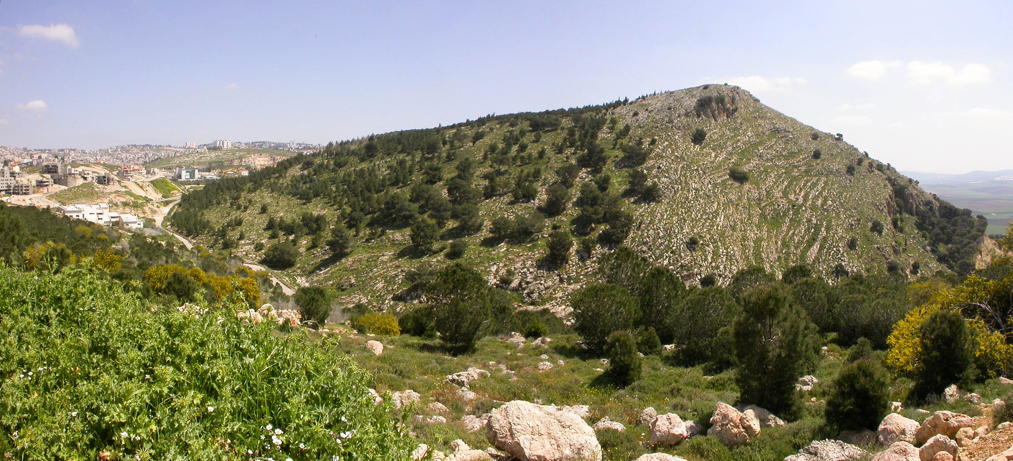 Mt. Precipice in Nazareth - suggested location of Luke 4:29 when the townsfolk took Yeshua 'up' the mountain, wanting to throw Him 'from' the cliff, 'down upon' the rocks, 'into' the valley below.  Again, He prevailed in His day of trouble.  Courtesy of the [Pictorial Library of Bible Lands](https://www.bibleplaces.com)