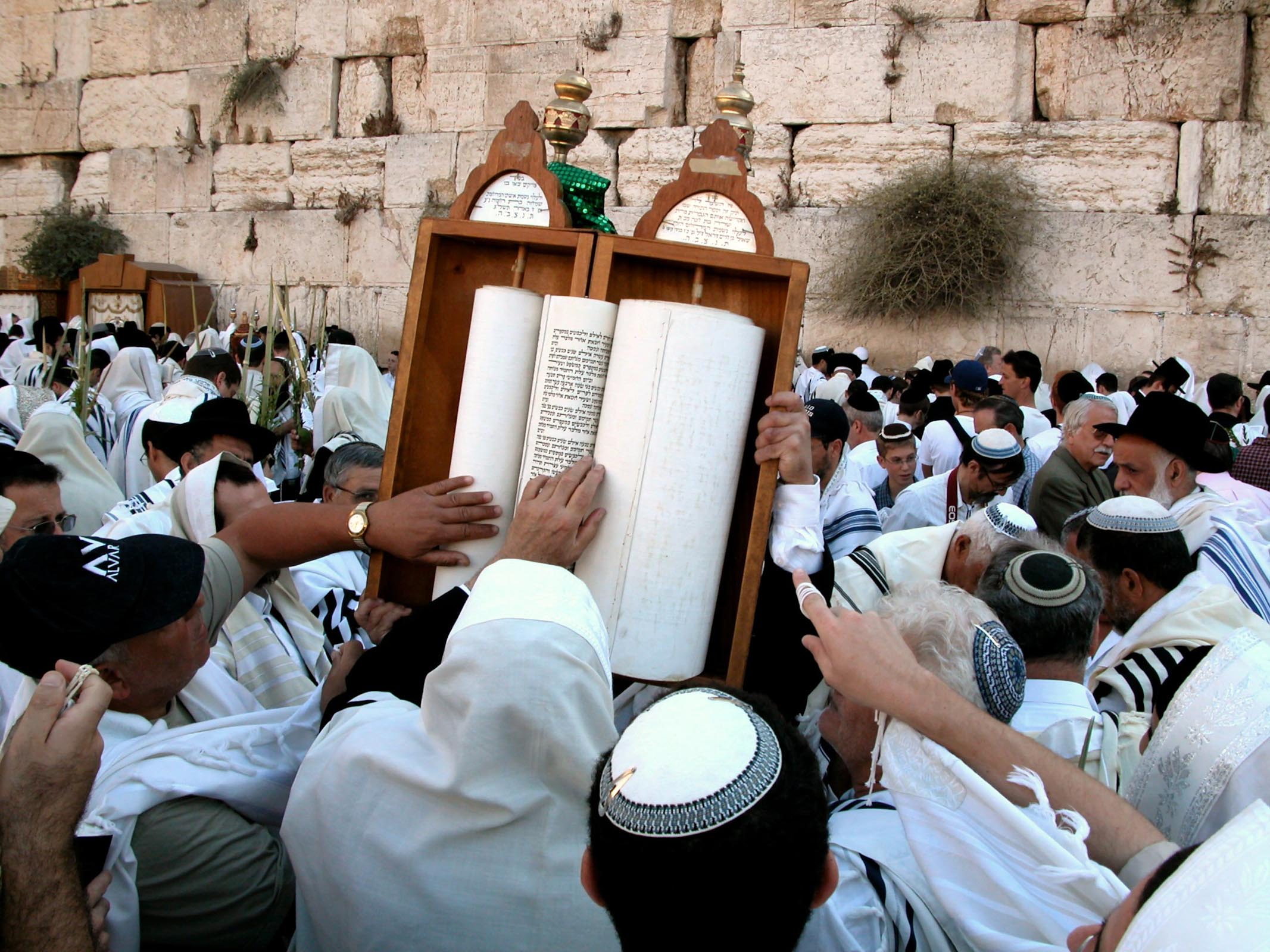 Men touching Torah Scroll at Western Wall. Courtesy of the [Pictorial Library of Bible Lands](https://www.bibleplaces.com)